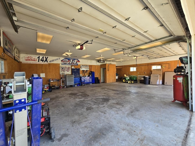 6809 S Joanne Ave, Rochelle, IL 61068 - garage featuring a garage door opener and refrigerator