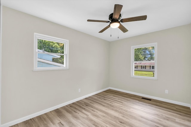 unfurnished room with ceiling fan and light hardwood / wood-style floors