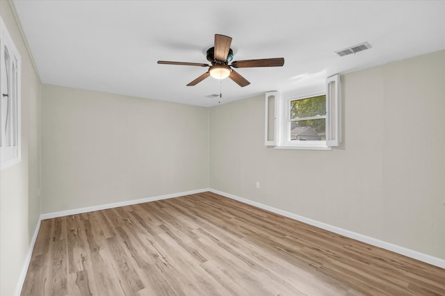 spare room featuring light hardwood / wood-style floors and ceiling fan