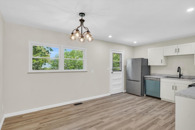 kitchen featuring light wood-type flooring, white cabinetry, sink, and stainless steel appliances