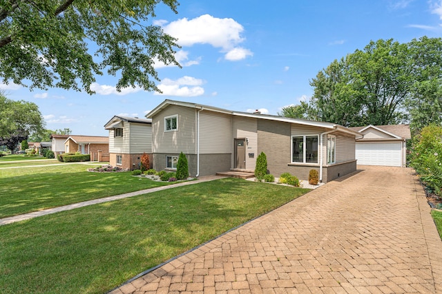 view of front of house featuring a front yard and a garage