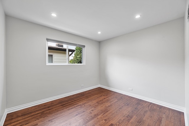 empty room featuring hardwood / wood-style flooring