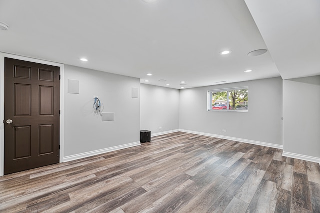 basement featuring wood-type flooring