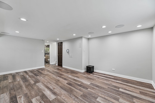 empty room with dark hardwood / wood-style floors