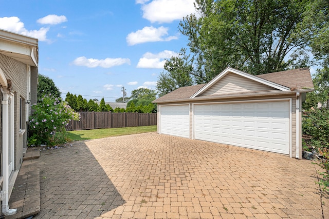 garage featuring a yard