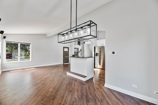 unfurnished dining area featuring lofted ceiling and dark wood-type flooring