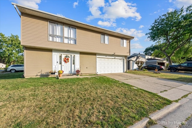 view of front of property featuring a front yard and a garage