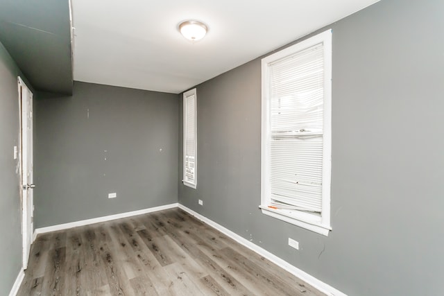 spare room featuring hardwood / wood-style flooring