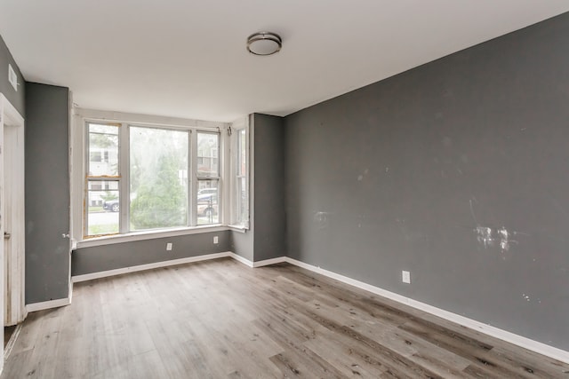 empty room featuring hardwood / wood-style flooring