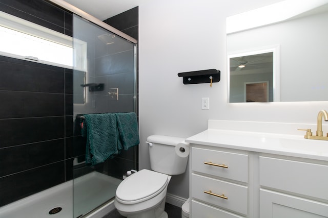 bathroom with walk in shower, vanity, and toilet