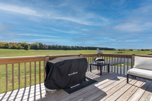 deck featuring a lawn and area for grilling