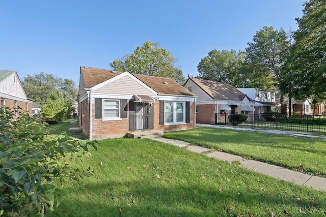 view of front of home with a front lawn