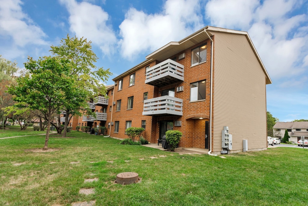 view of building exterior featuring a fire pit