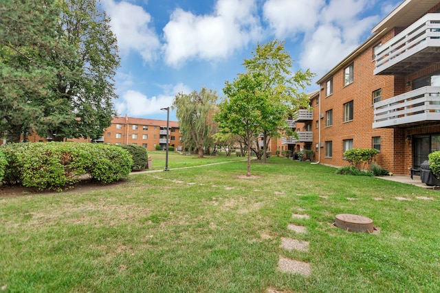 view of yard featuring a balcony