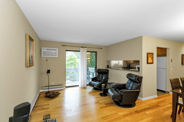 living room featuring a baseboard radiator, light wood-type flooring, and a wall mounted AC