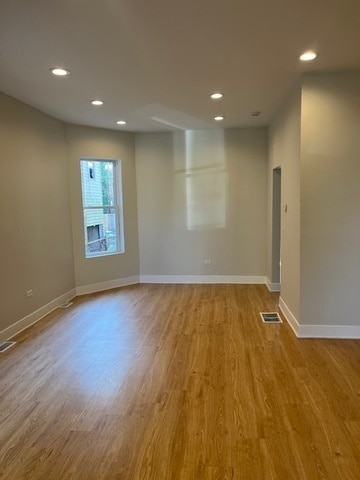 spare room featuring light wood-type flooring