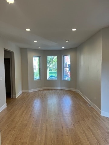 unfurnished room featuring light hardwood / wood-style flooring