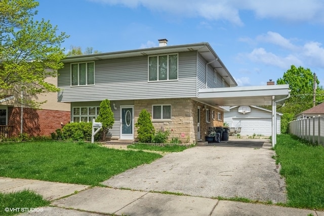 view of front of home featuring a garage, a front yard, and a carport