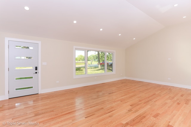 interior space with lofted ceiling and light hardwood / wood-style floors