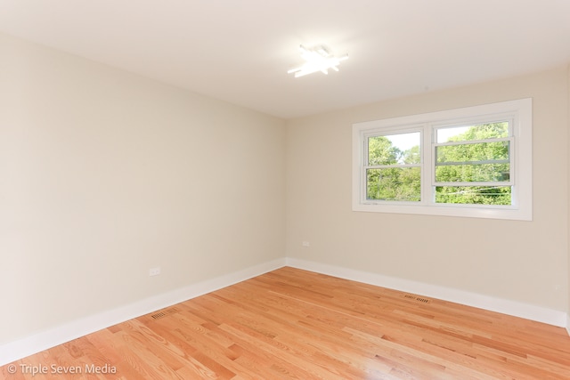 unfurnished room featuring light wood-type flooring