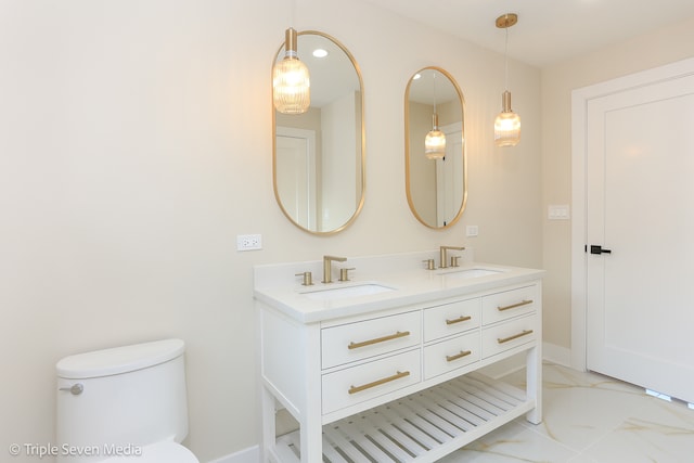 bathroom with vanity and toilet