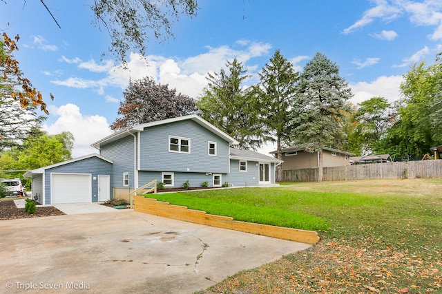 view of home's exterior with a garage and a yard