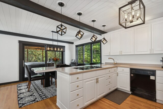 kitchen with black dishwasher, white cabinetry, and pendant lighting