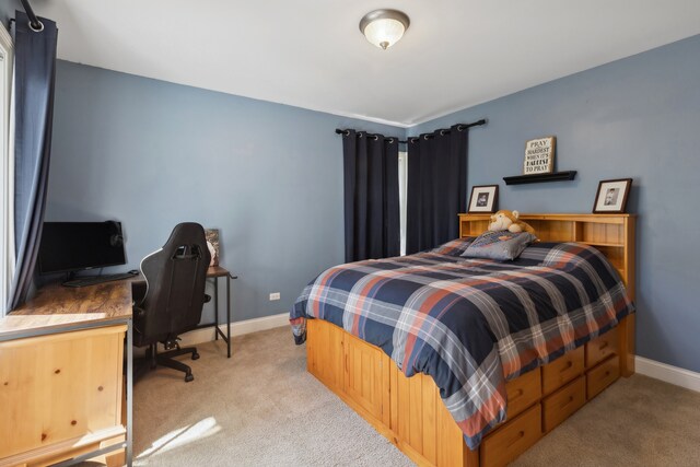 bedroom with light carpet