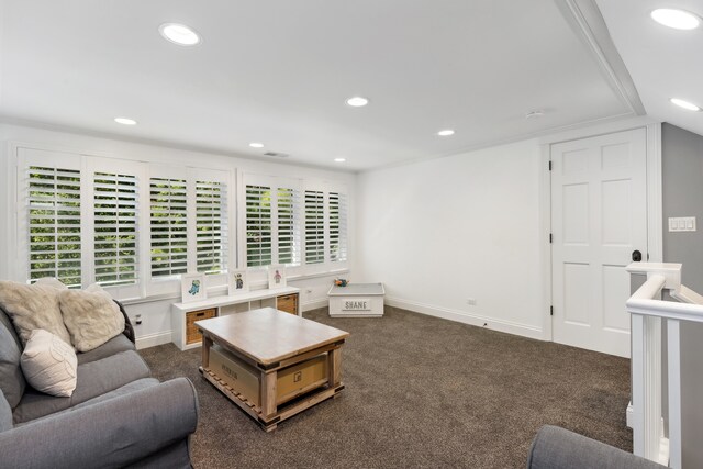 carpeted living room featuring crown molding and lofted ceiling