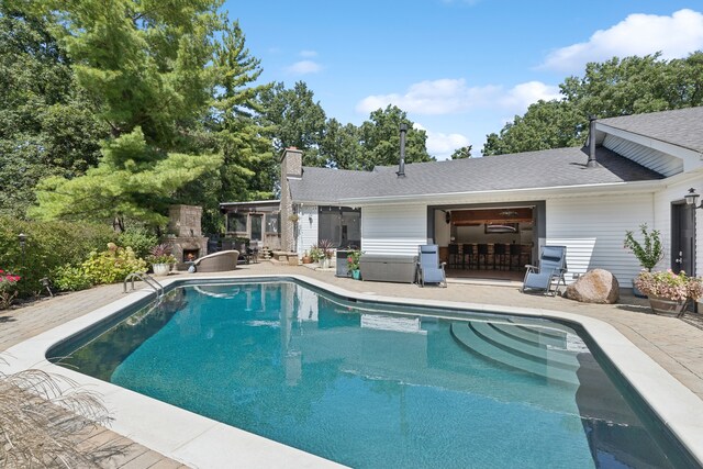 view of swimming pool with a patio area