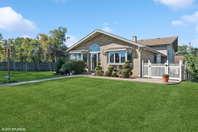 ranch-style house with a front yard