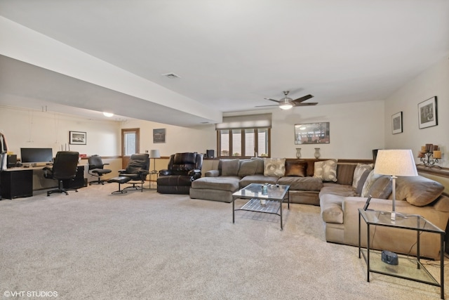 carpeted living room featuring ceiling fan