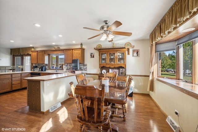 dining room with plenty of natural light, hardwood / wood-style flooring, and ceiling fan