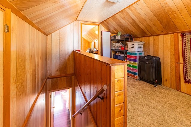 bonus room with wood ceiling, lofted ceiling, wood walls, and carpet floors