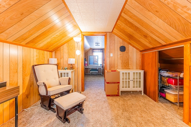 living area featuring carpet, lofted ceiling, and wood walls