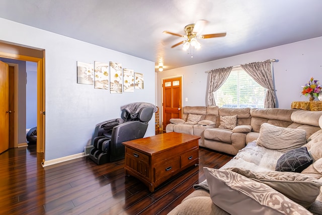 living room with ceiling fan and dark wood-type flooring