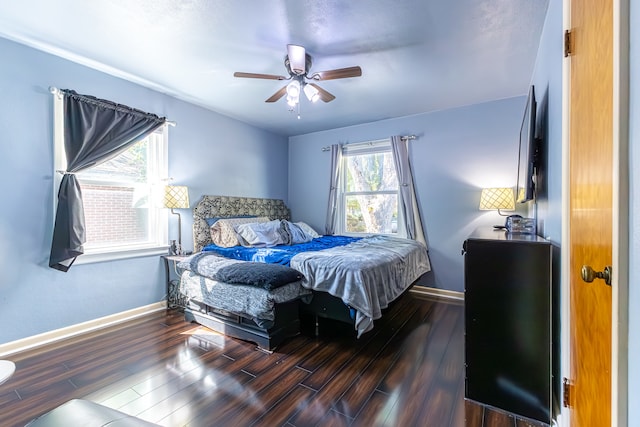 bedroom featuring dark hardwood / wood-style flooring and ceiling fan