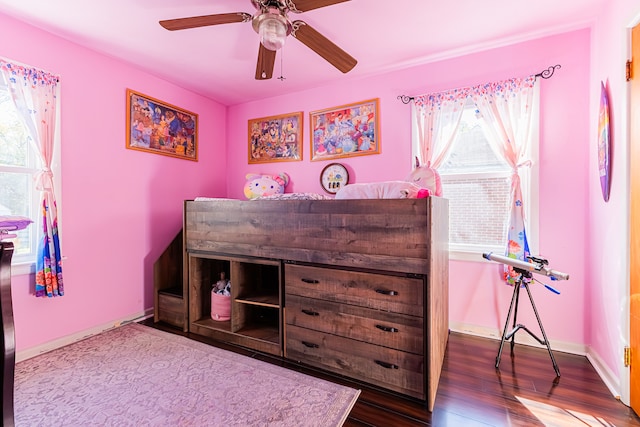 bedroom with wood-type flooring and ceiling fan