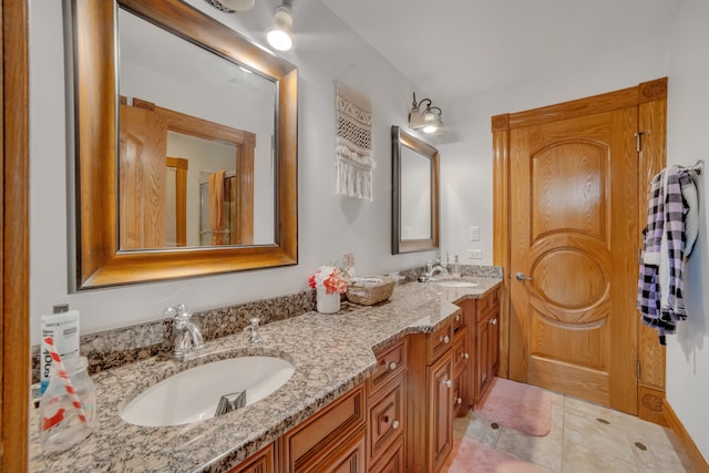 bathroom with vanity and tile patterned floors