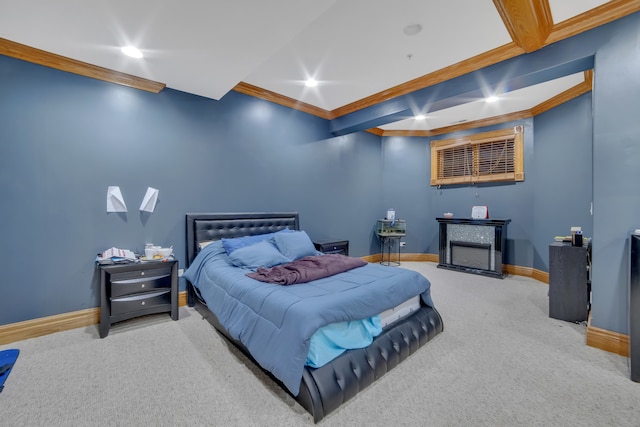 bedroom with carpet floors and crown molding