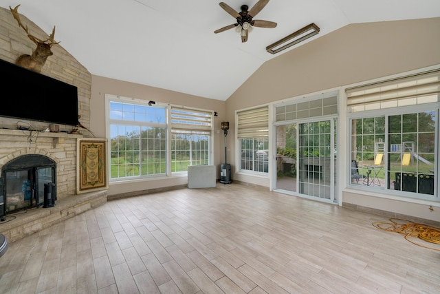 interior space featuring ceiling fan and a fireplace