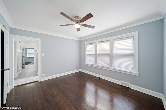 spare room with ceiling fan, crown molding, and hardwood / wood-style floors