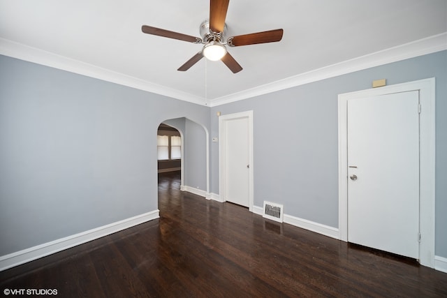 spare room with ornamental molding, ceiling fan, and dark hardwood / wood-style flooring