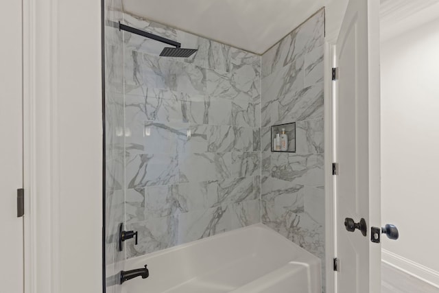 bathroom featuring tiled shower / bath combo and hardwood / wood-style floors