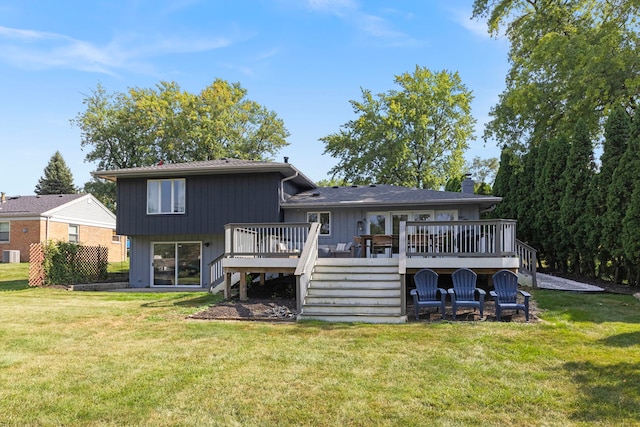 back of house featuring a yard, central air condition unit, and a wooden deck