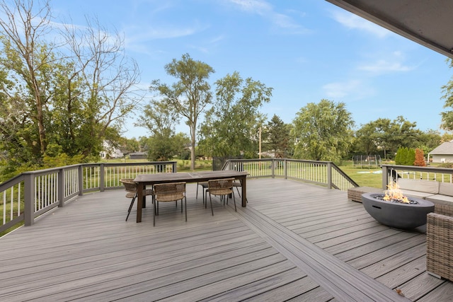 deck featuring an outdoor fire pit