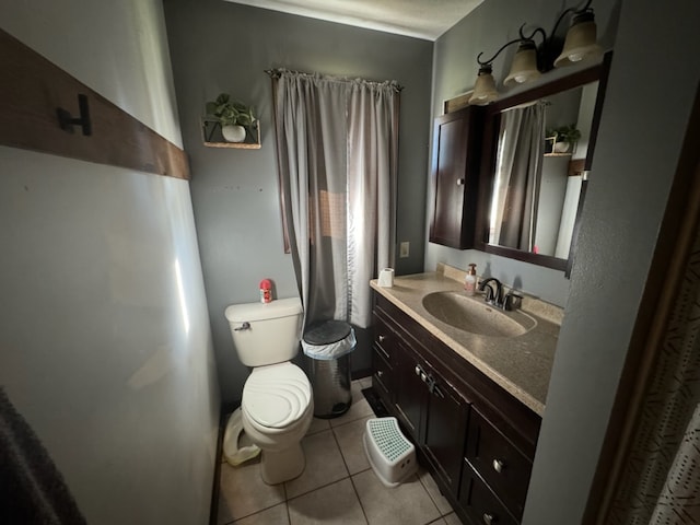 bathroom with tile patterned floors, vanity, and toilet