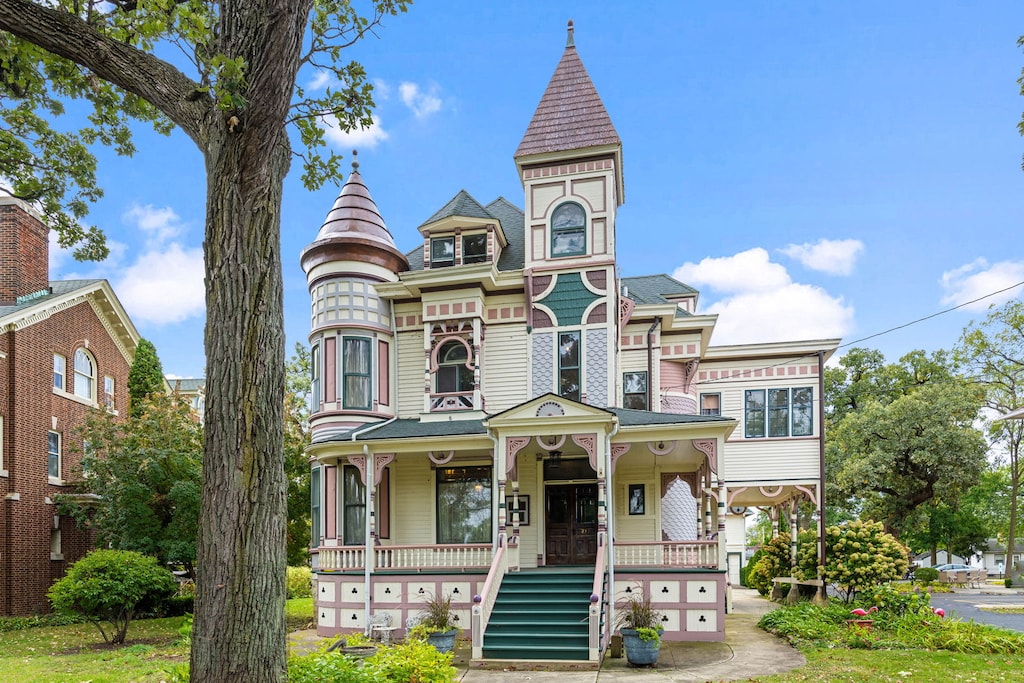 214 S State St, Elgin, IL 60123 - victorian-style house featuring covered porch