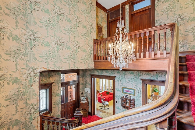 interior details with an inviting chandelier and crown molding