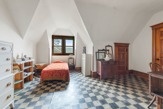 sitting room featuring vaulted ceiling